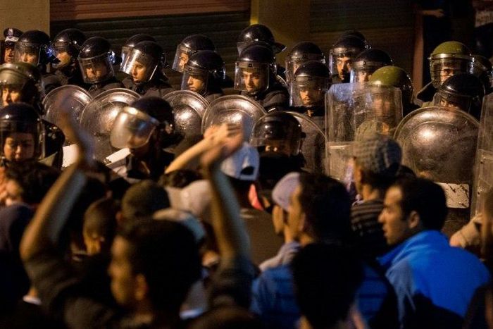 Police face protesters during a night demonstration in Morocco's Al-Hoceima on June 9, 2017
