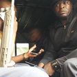 Embakasi Central MP Benjamin Gathiru (in yellow shirt) at the back of a police Land Rover (Twitter)