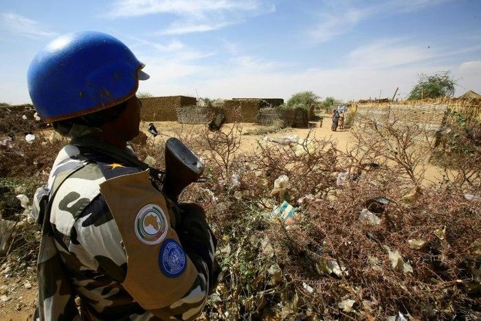 A member of the peacekeeper troops stands guard at a UN refugee camp in the city of Nyala, in South Darfur, on January 9, 2017