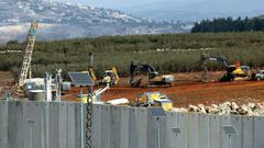 Israeli soldiers deploy excavators alongside the border wall with Lebanon on December 5, 2018, after the army announced it had discovered Hezbollah infiltration tunnels passing under it