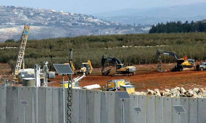 Israeli soldiers deploy excavators alongside the border wall with Lebanon on December 5, 2018, after the army announced it had discovered Hezbollah infiltration tunnels passing under it