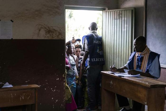 Classroom queue: Voters wait outside a polling station at the Institute Maendeleo in Kabare, South Kivu province