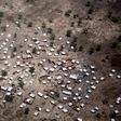 Aerial view. Up to 25,000 people were displaced during government offensives on the West Bank of the Nile river in April and May. Many walked for days on foot without access to sufficient water and arrived exhausted and weak