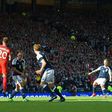 Scotland's striker Leigh Griffiths (R) hits a freekick over the England wall to score their second goal during the group F World Cup qualifying football match between Scotland and England at Hampden Park in Glasgow - the game ended 2-2