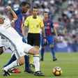 Dutch former Barcelona forward Patrick Kluivert (R) tackles ex-Manchester United defender Lee Martin during a charity match between Barcelona Legends and Man United Legends at the Camp Nou stadium in Barcelona on June 30, 2017