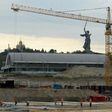 Construction site of the Arena Pobeda (Victory Stadium) football stadium in Volgograd, with the statue of Mother Homeland seen in the background