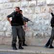 Israeli borderguards search a Palestinian man outside Damascus Gate in Jerusalem's Old City on June 16, 2017, following an attack