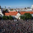 Demonstrators hold up flags of Slovakia and EU during an anti-corruption rally in Bratislava on June 5, 2017
