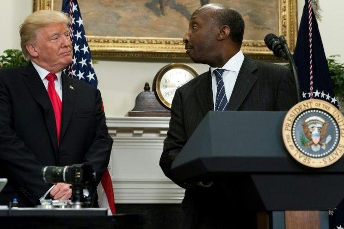 Merck CEO Kenneth Frazier is seen here with President Donald Trump at a White House event in July.