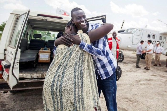 Emmanuel, 17, hugs his mother as they reunite in Aburoc, South Sudan after more than three years, forced apart by the civil war which began in 2013