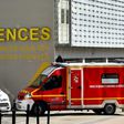 An ambulance and a firefighting vehicle are pictured in front of the Nantes CHU Hospital in this file photo from March 2017