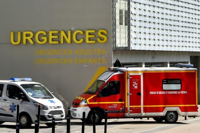 An ambulance and a firefighting vehicle are pictured in front of the Nantes CHU Hospital in this file photo from March 2017