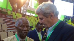 John Kerry consulting Former SA President Thabo Mbeki