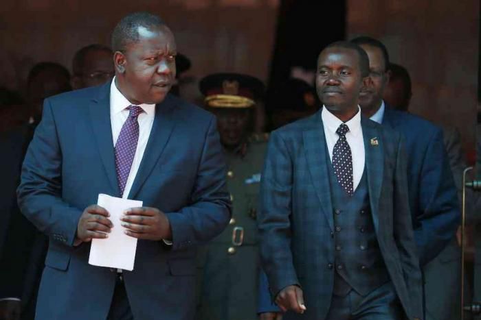 Interior CS Fred Matiang'i and ICT CS Joe Mucheru. Government takes action after M-Pesa outage