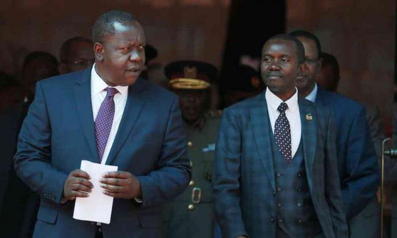 Interior CS Fred Matiang'i and ICT CS Joe Mucheru. Government takes action after M-Pesa outage
