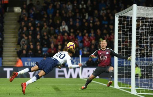 Diving Dele: Dele Alli (left) scored Tottenham's second goal with a diving header in a 2-0 win at Leicester
