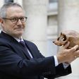 French paleoanthropologist Jean-Jacques Hublin poses with the casting of a Homo Sapiens skull discovered in Morocco. The human species roamed Africa 300,000 years ago, according to new research that pushes back human origins by 100,000 years.