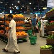 Customers are seen shopping at the al-Meera market in the Qatari capital Doha, on June 10, 2017. Saudi Arabia, Egypt, the UAE and Bahrain announced on June 5 they were cutting diplomatic ties and closing air, sea and land links with Qatar