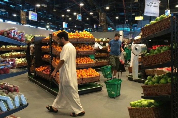 Customers are seen shopping at the al-Meera market in the Qatari capital Doha, on June 10, 2017. Saudi Arabia, Egypt, the UAE and Bahrain announced on June 5 they were cutting diplomatic ties and closing air, sea and land links with Qatar