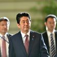 Japanese Prime Minister Shinzo Abe (C) has seen public support rates plummet in the past few months over an array of political troubles