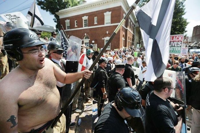 White nationalists, neo-Nazis and members of the 'alt-right' exchange insluts with counter-protesters in Charlottesville, Virginia, on August 12, 2017