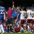 Chelsea's Gary Cahill (C) is shown a red card by referee Craig Pawson after a foul on Burnley's Steven Defour during their English Premier League match, at Stamford Bridge in London, on August 12, 2017