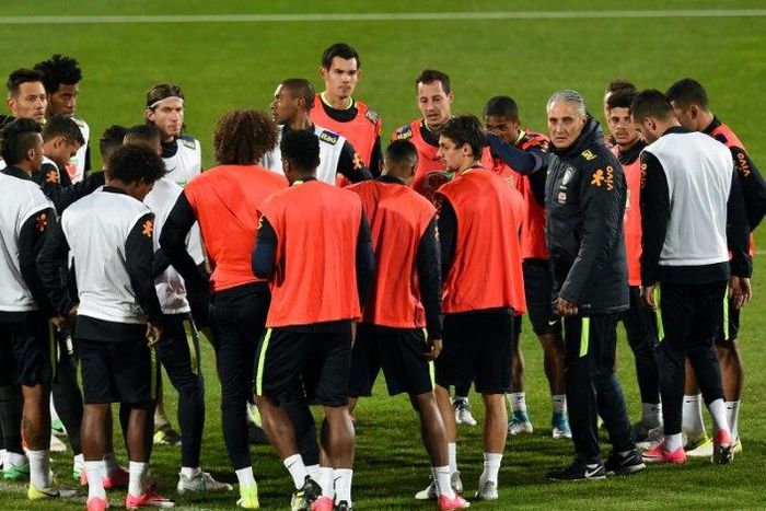 Brazil's head coach Tite (4th R) instructs his players during a training session in Melbourne, on June 7, 2017