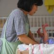 A social worker caring for a baby at the Jusarang Community Church in South Korea, where the number of abandoned babies has jumped in recent years in the wake of a law intended to protect children.