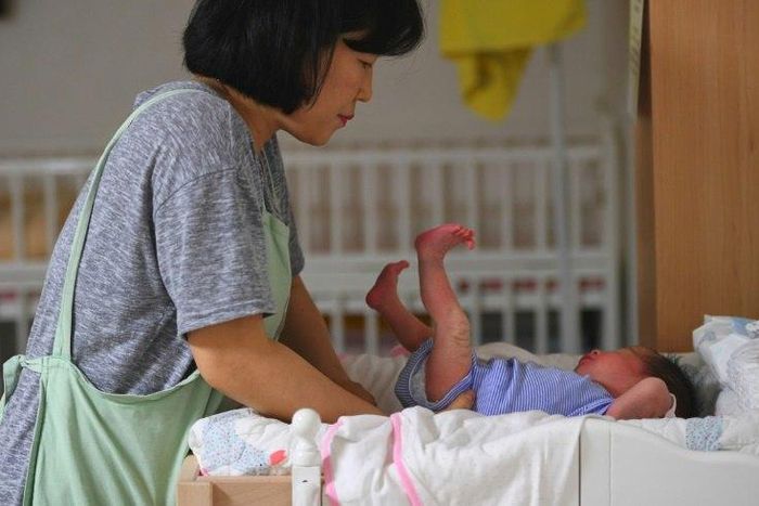 A social worker caring for a baby at the Jusarang Community Church in South Korea, where the number of abandoned babies has jumped in recent years in the wake of a law intended to protect children.
