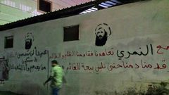 The Shiite-majority town of Awamiya in Saudi Arabia was the home of executed Shiite cleric Nimr al-Nimr, represented here in a tribute graffiti