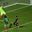 Mexico's forward Oribe Peralta (C) scores a goal past New Zealand's goalkeeper Stefan Marinovic (back) during the 2017 Confederations Cup group A football match June 21, 2017