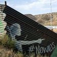 Partial view of the US-Mexico border wall painted by members of the Brotherhood Mural organization in Tijuana, Mexico