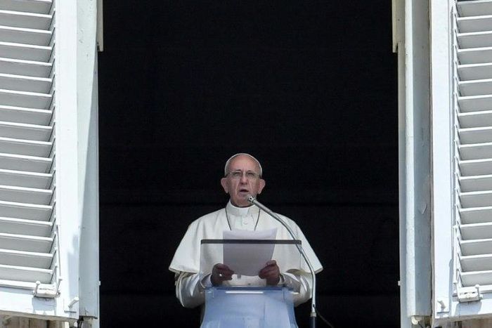 Pope Francis delivers his speech to the crowd from the window of the apostolic palace overlooking St Peter's square during the Sunday Angelus prayer, on July 2, 2017 at the Vatican