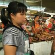 Vendors stand behind a pile of dog meat at the Nanqiao market in Yulin