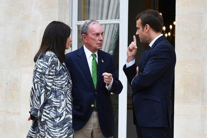 Former New York mayor, Michael Bloomberg, seen here meeting with French President Emmanuel Macron and Paris mayor Anne Hidalgo, leads a group of US business and government leaders pledging continued support for the Paris climate accord