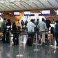 Passengers wait to check-in at the Hamad International Airport in Doha on June 7, 2017 after a ban on Qatari flights imposed by Saudi Arabia and its allies which cut ties with Doha and ordered Qataris out