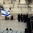 Ultra-Orthodox Jewish men (L) and women (R) pray in different sections of the Western Wall in Jerusalem's Old City on February 2, 2016