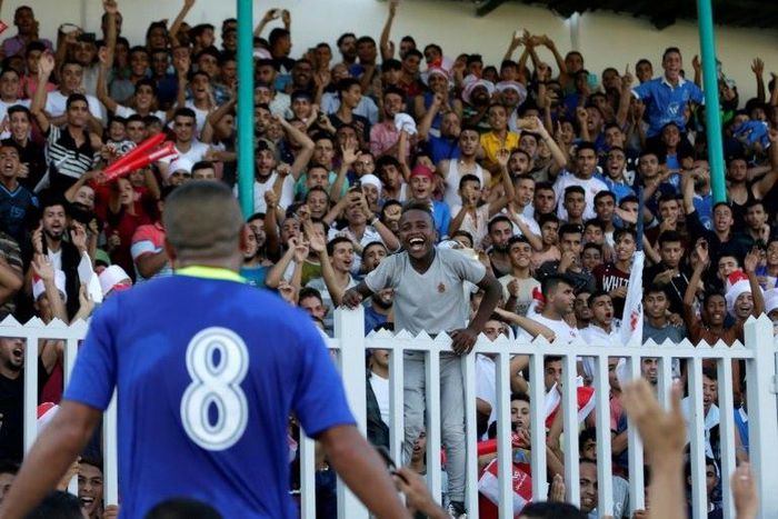 Fans of Gaza's Shabab Rafah football club celebrate their team's 2-0 victory against Hebron's Ahly al-Khalil in the first leg of the Palestine Cup final on August 1, 2017