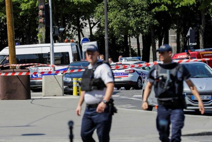 Police seal off an area of the Champs-Elysees in Paris on June 19, 2017