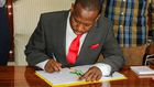 Nairobi Governor Sonko signing a document