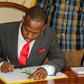 Nairobi Governor Sonko signing a document