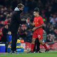 Liverpool's Philippe Coutinho (C) shakes hands with team manager Jurgen Klopp during a EFL (English Football League) Cup match in Liverpool, in January 2017