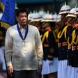 Philippine President Rodrigo Duterte inspects a police honour guard