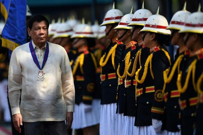 Philippine President Rodrigo Duterte inspects a police honour guard