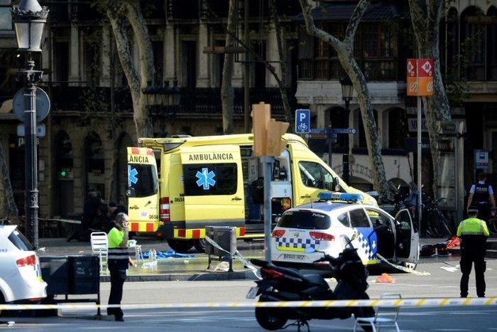 Police cordon off Barcelona's popular Las Ramblas area after a van drives into a crowd of people in what is described as a terrorist attack