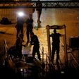 Israeli security forces take down security barriers at the Lions' Gate, a main entrance to the Al-Aqsa mosque compound in Jerusalem's Old City, on July 24, 2017
