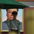 A paramilitary police officer stands guard in front of the portrait of Mao Zedong in Tiananmen Square. Flamboyant real estate tycoon Guo Wengui is waging a one-man guerrilla war against China's elite with explosive accusations of corruption