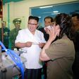 This undated picture released from North Korea's official Korean Central News Agency (KCNA) on June 20, 2017 shows North Korean leader Kim Jong-Un (C) visiting a newly-built dental sanitary goods factory at an undisclosed location in North Korea