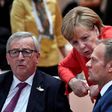 EU President Donald Tusk (R) is urging G20 leaders to be more determined to fight against people smugglers in the migrant crisis