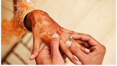 Couple exchanging rings